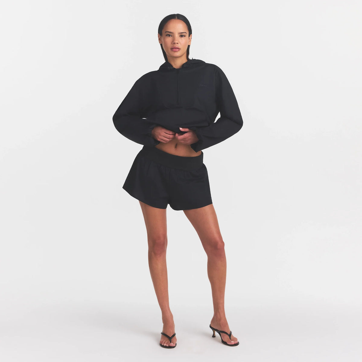 WOVEN COTTON FLUTTER SHORT | ONYX ON A MODEL FRONT VIEW @ | FOCUS: 0.0, 1.0, 0.9