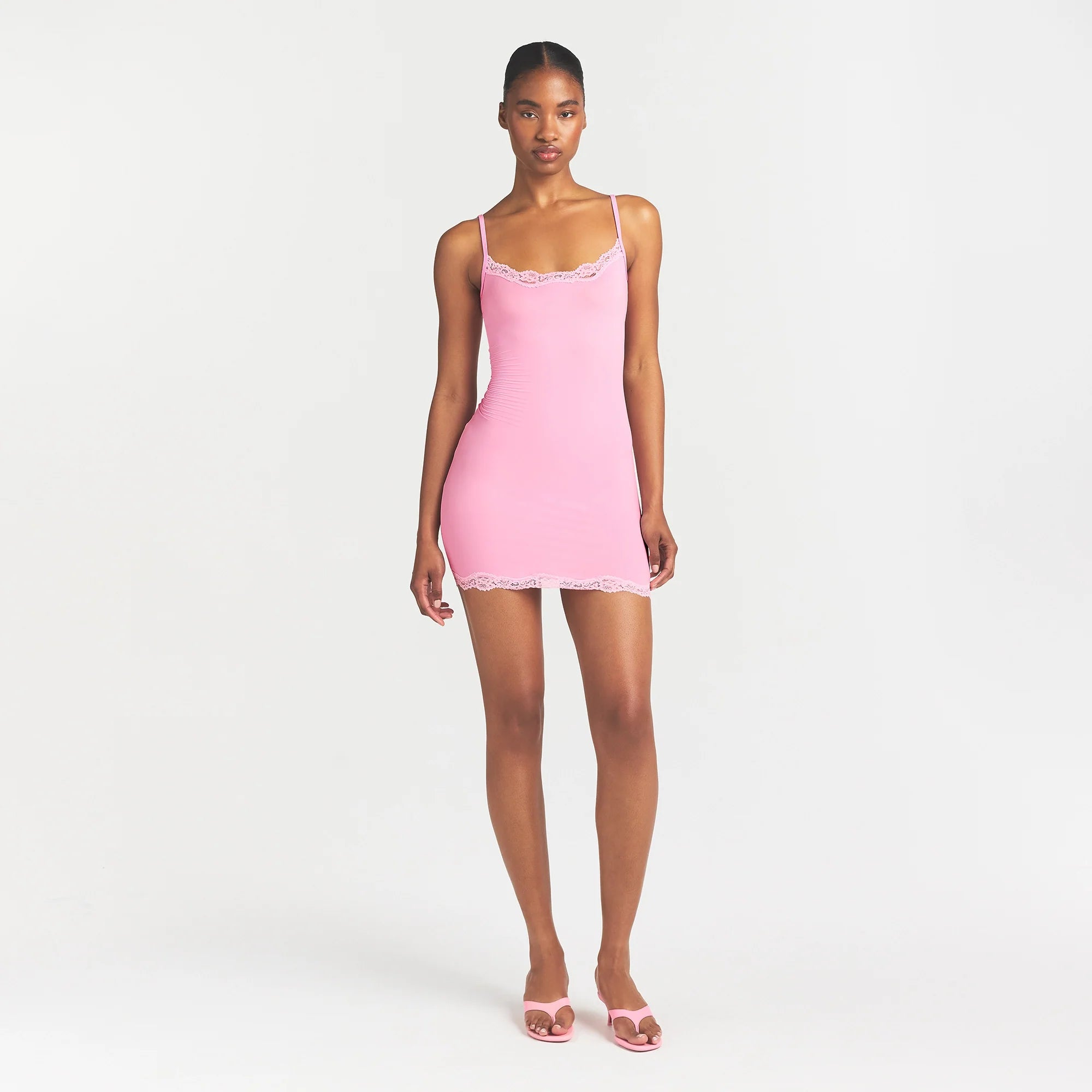 FITS EVERYBODY LACE SLIP DRESS | BUBBLE GUM TONAL ON A MODEL FRONT VIEW @ | FOCUS: 0.0, 1.0, 0.9
