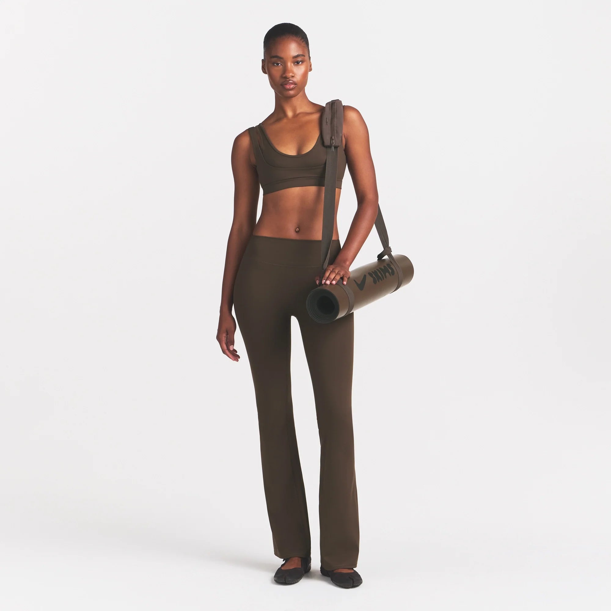 NikeSKIMS MATTE DOUBLE STRAP SCOOP BRA | DARK SEPIA ON A MODEL FRONT VIEW @ | FOCUS: 0.0, 1.0, 0.9