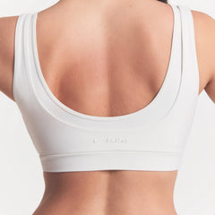 NikeSKIMS MATTE DOUBLE STRAP SCOOP BRA | IVORY ON A MODEL