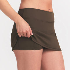 NikeSKIMS MATTE SKORT | NSKM DARK SEPIA ON A MODEL