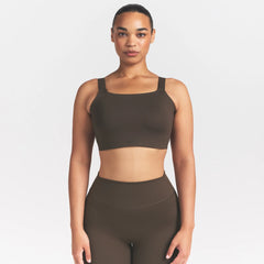 NikeSKIMS MATTE WIDE STRAP BRA | DARK SEPIA ON A MODEL FRONT VIEW @ | FOCUS: 0.9, 0.1, 0.7