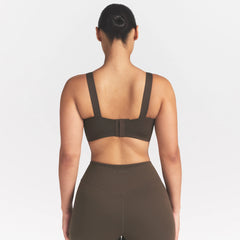 NikeSKIMS MATTE WIDE STRAP BRA | DARK SEPIA ON A MODEL FRONT VIEW @ | FOCUS: 0.9, 0.1, 0.7