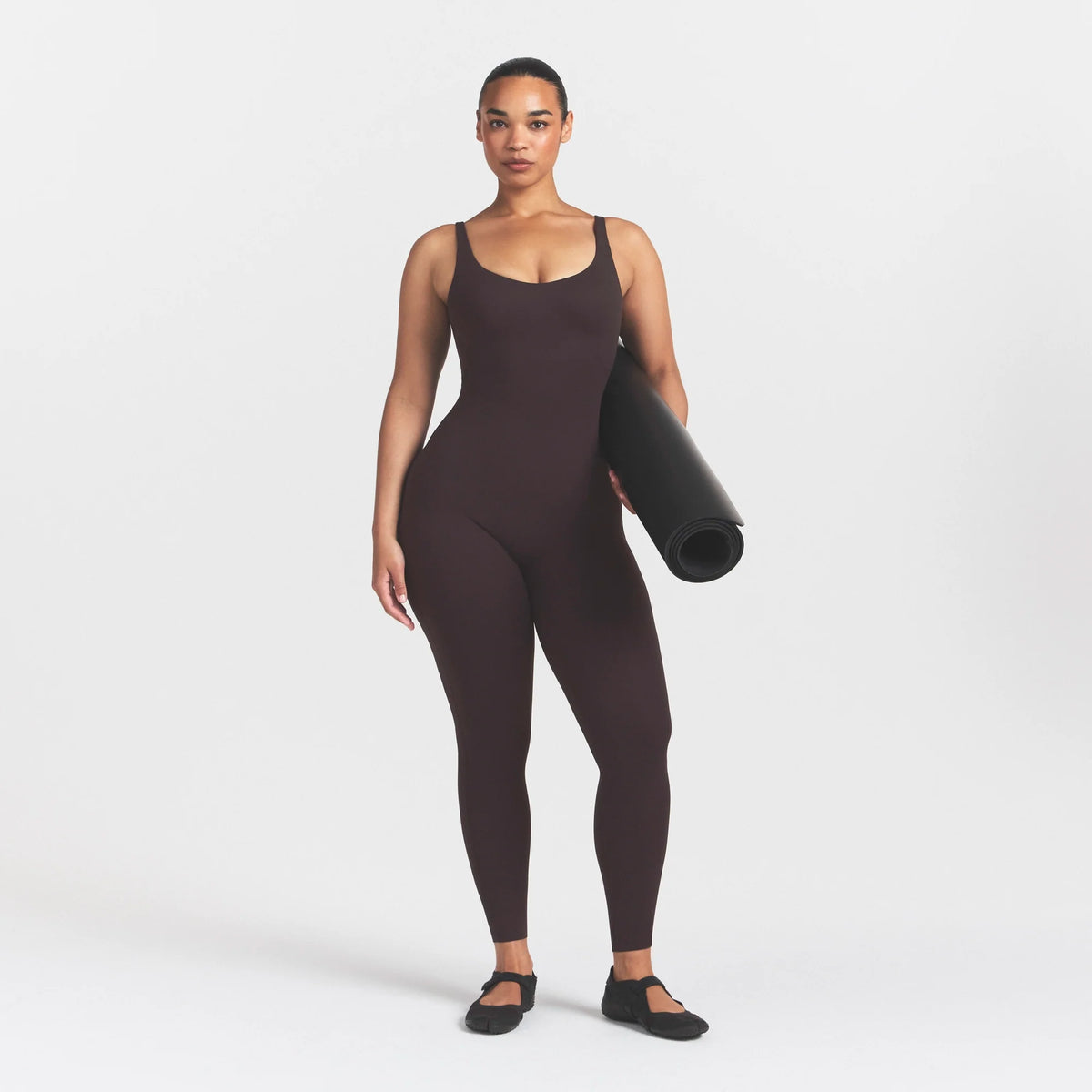 NikeSKIMS STUDIO STRETCH LONG 29" ONE PIECE | DARK ROASTON A MODEL FRONT