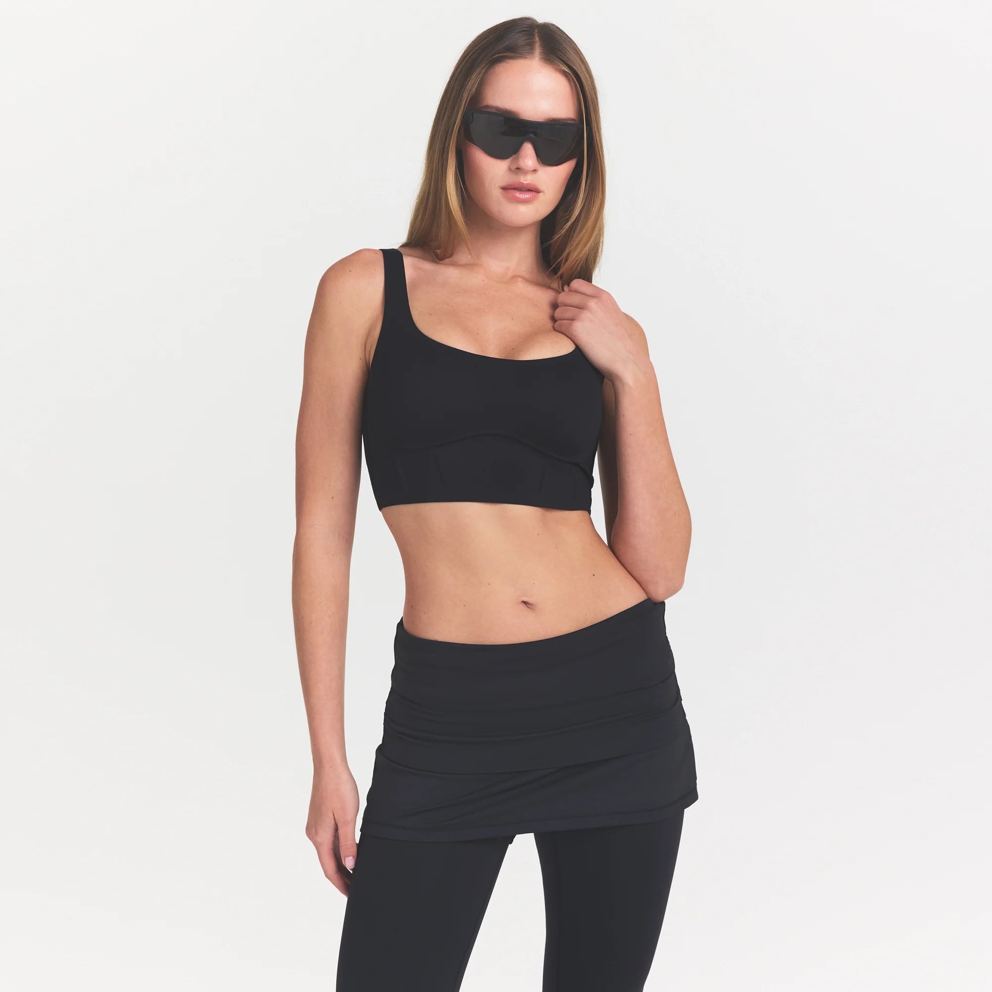 NikeSKIMS MATTE CORSET LONGLINE BRA | OBSIDIAN ON A MODEL