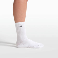 NikeSKIMS ACCESSORIES DRI-FIT PILATES GRIP CREW SOCK | SNOW FLAT ON A WHITE BACKGROUND