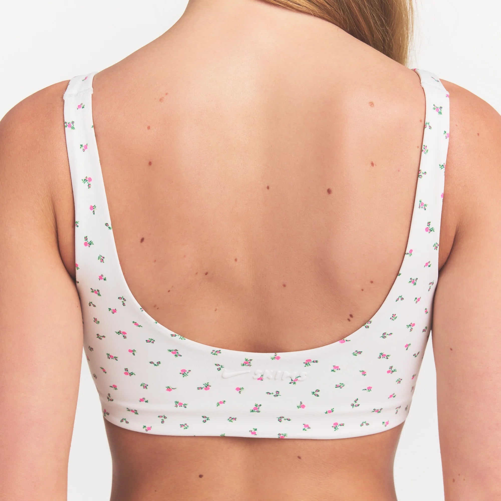 NikeSKIMS MATTE SCOOP NECK BRA | DITSY FLORAL PRINT ON A MODEL