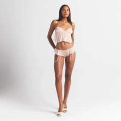 SKIMS ROMANCE BABYDOLL AND GARTER HIPSTER SET | PRIMROSE ON A MODEL FRONT VIEW @ | FOCUS: 0.0, 1.0, 0.9