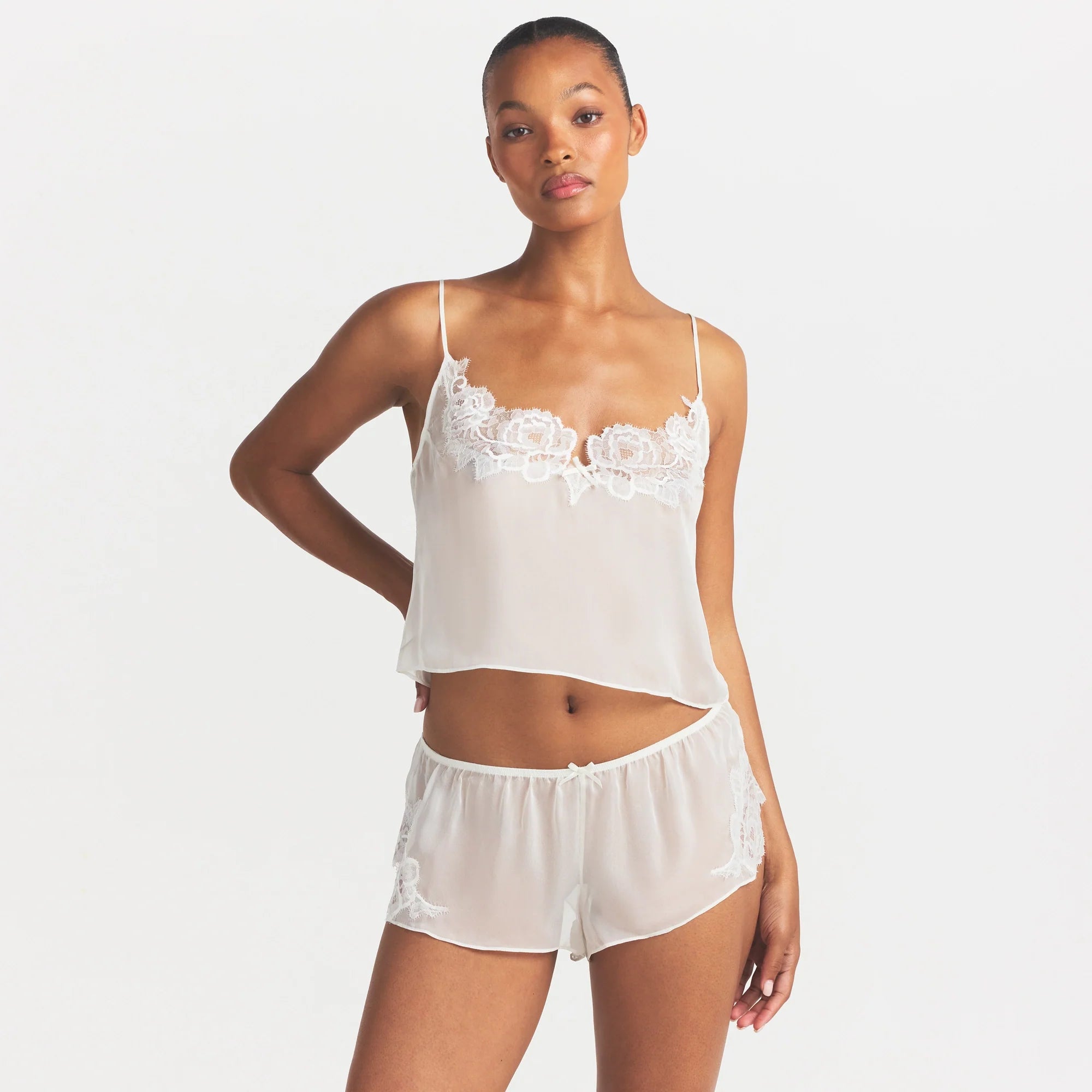 SKIMS ROMANCE CAMI AND SHORT SET | IVORY ON A MODEL SIDE VIEW @ | FOCUS: 0.0, 1.0, 0.9