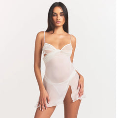SKIMS ROMANCE DRAPED MINI SLIP DRESS | IVORY ON A MODEL SIDE VIEW @ | FOCUS: 0.0, 1.0, 0.9