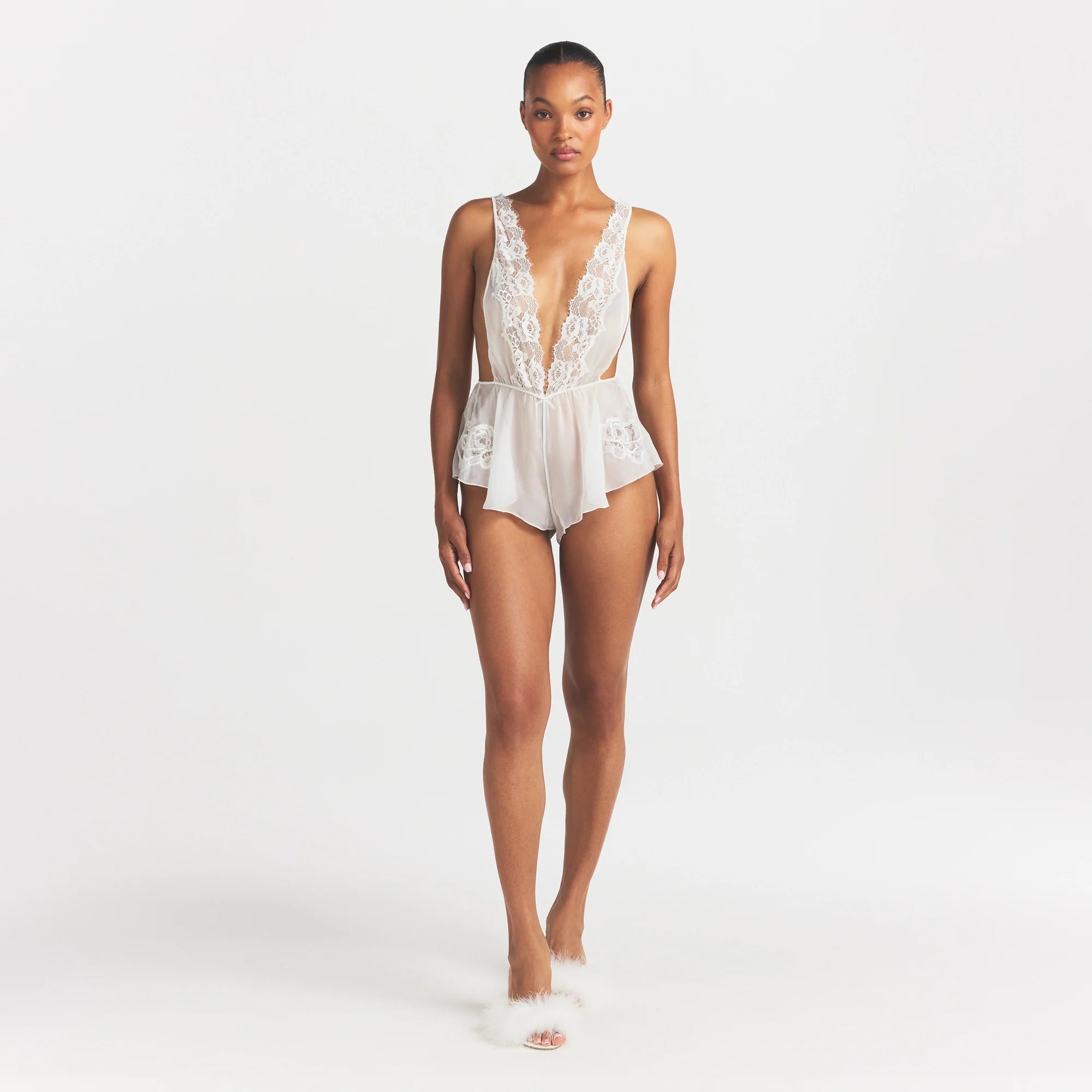 SKIMS ROMANCE PLUNGE TEDDY | IVORY ON A MODEL FRONT VIEW @ | FOCUS: 0.0, 1.0, 0.9