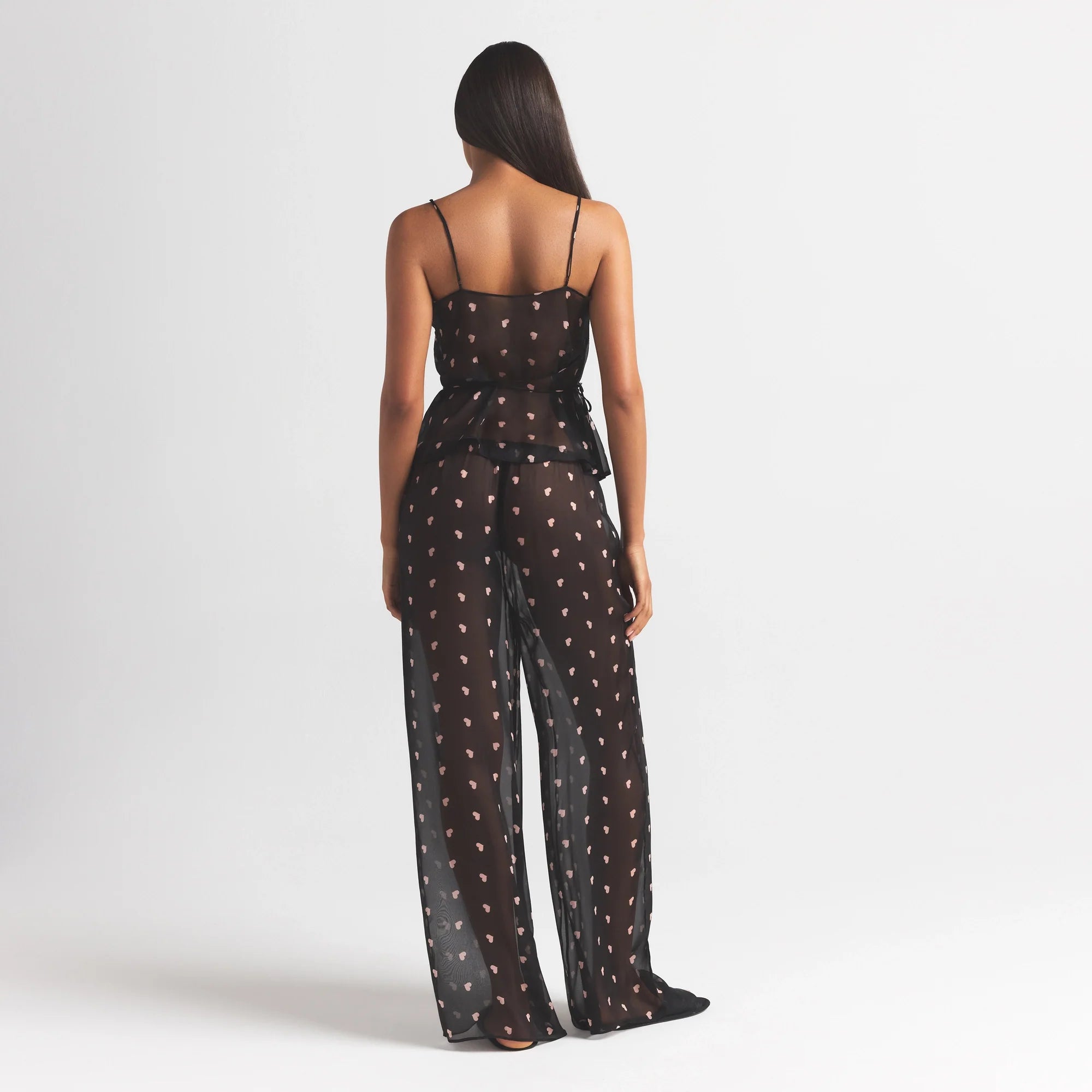 SKIMS ROMANCE WRAP CAMI TOP | OBSIDIAN SPACED HEARTS ON A MODEL FRONT VIEW @ | FOCUS: 0.0, 1.0, 0.9