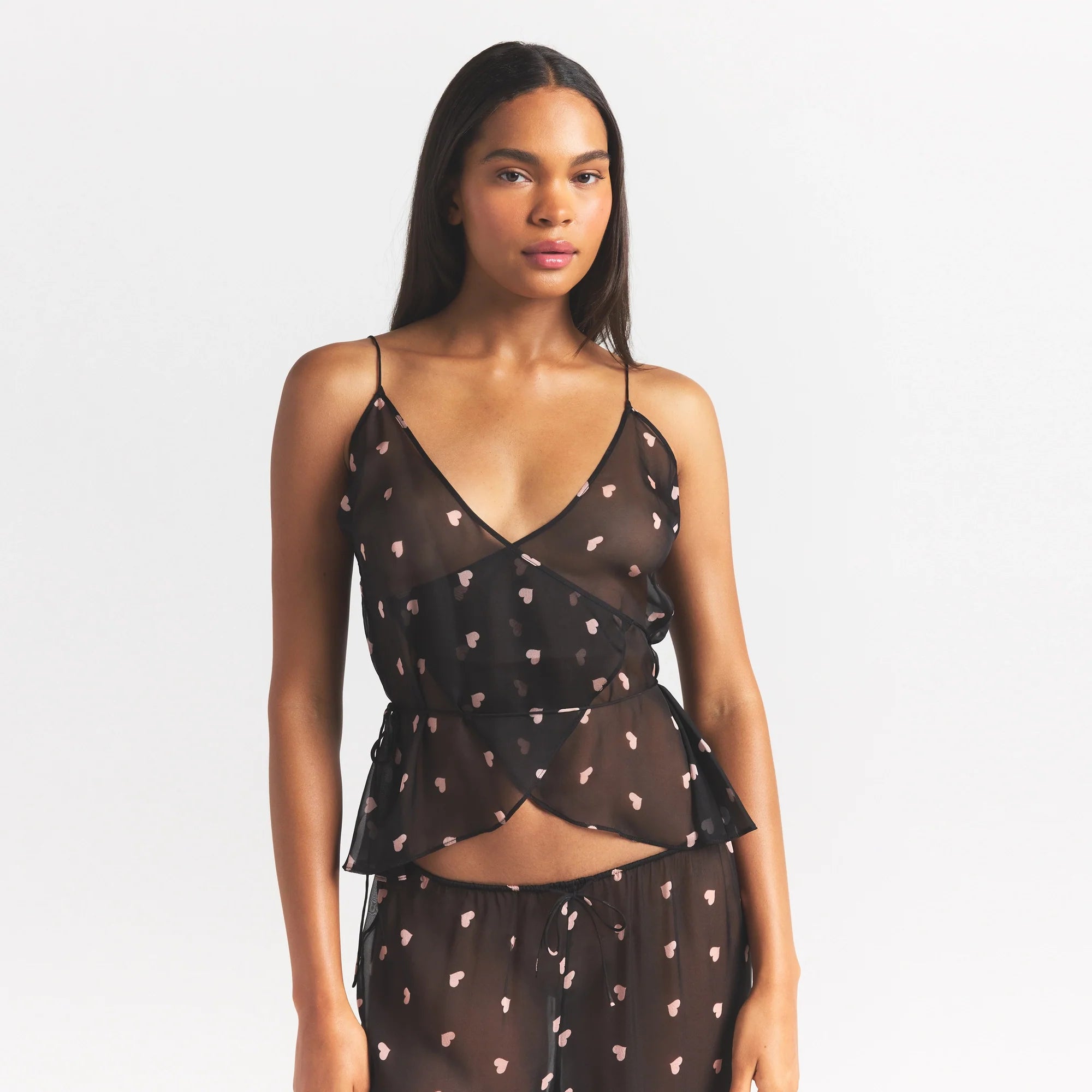 SKIMS ROMANCE WRAP CAMI TOP | OBSIDIAN SPACED HEARTS ON A MODEL SIDE VIEW @ | FOCUS: 0.0, 1.0, 0.9