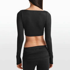 NikeSKIMS MATTE WRAP LONG SLEEVE CROPPED TOP | OBSIDIAN ON A MODEL FRONT VIEW @ | FOCUS: 0.0, 1.0, 0.9