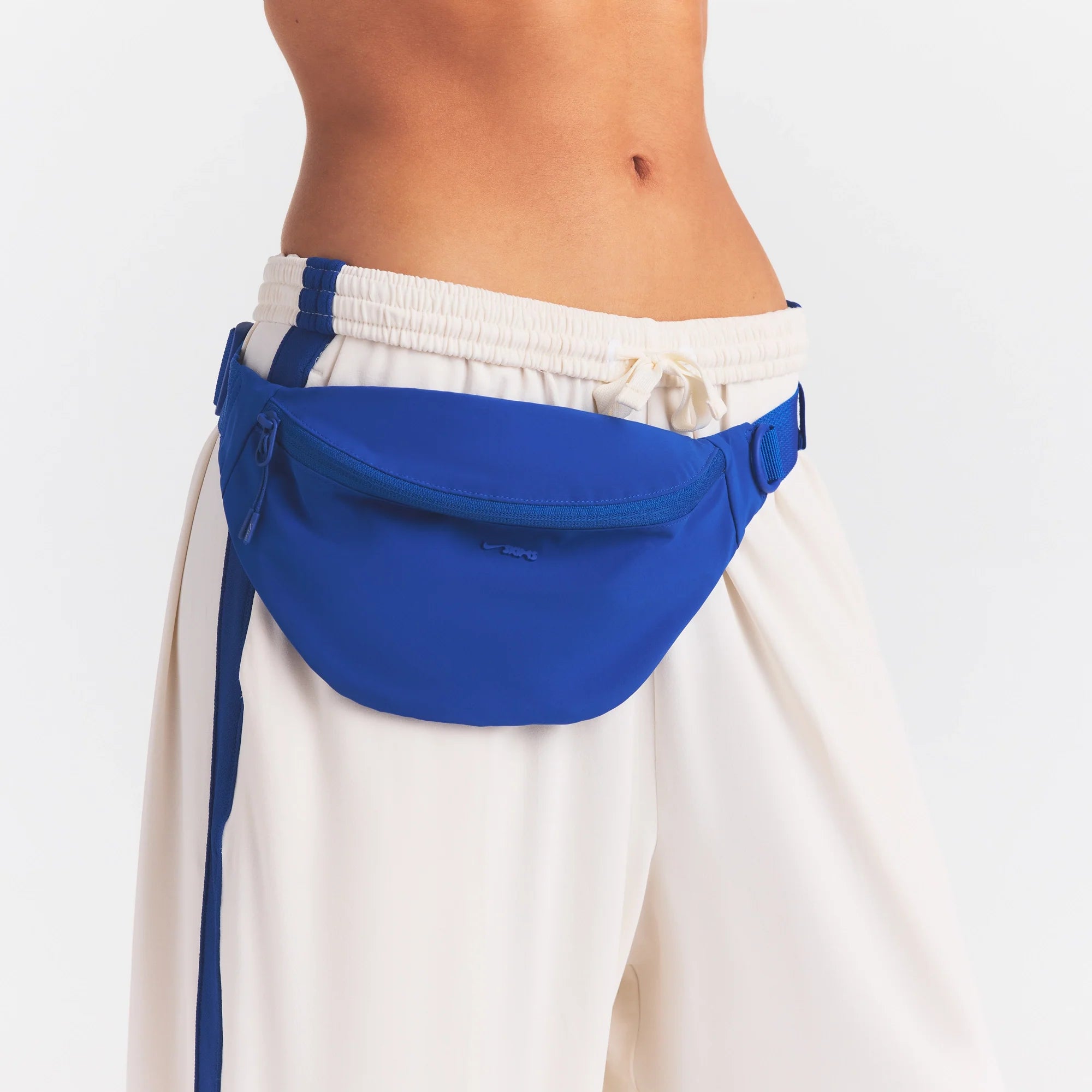 NikeSKIMS ACCESSORIES FANNY PACK | COBALT ON A MODEL SIDE VIEW @ | FOCUS: 0.0, 1.0, 0.9