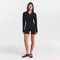 NikeSKIMS SATIN SHINE BONDED WAIST 5" BIKER SHORT | OBSIDIAN ON A MODEL FRONT VIEW