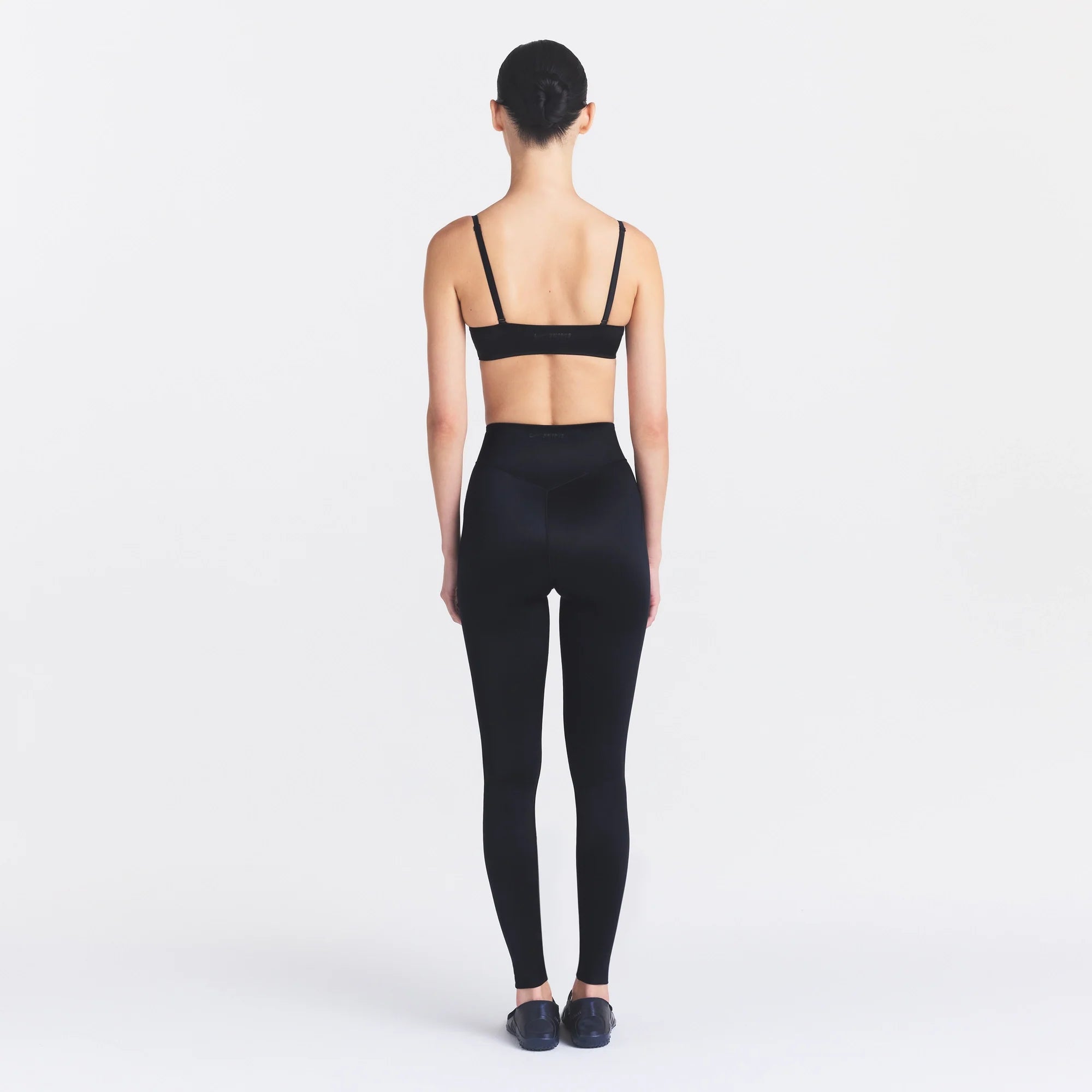 NikeSKIMS SATIN SHINE SCOOP CAMI BRA | OBSIDIAN ON A MODEL FRONT VIEW @ | FOCUS: 0.0, 1.0, 0.9