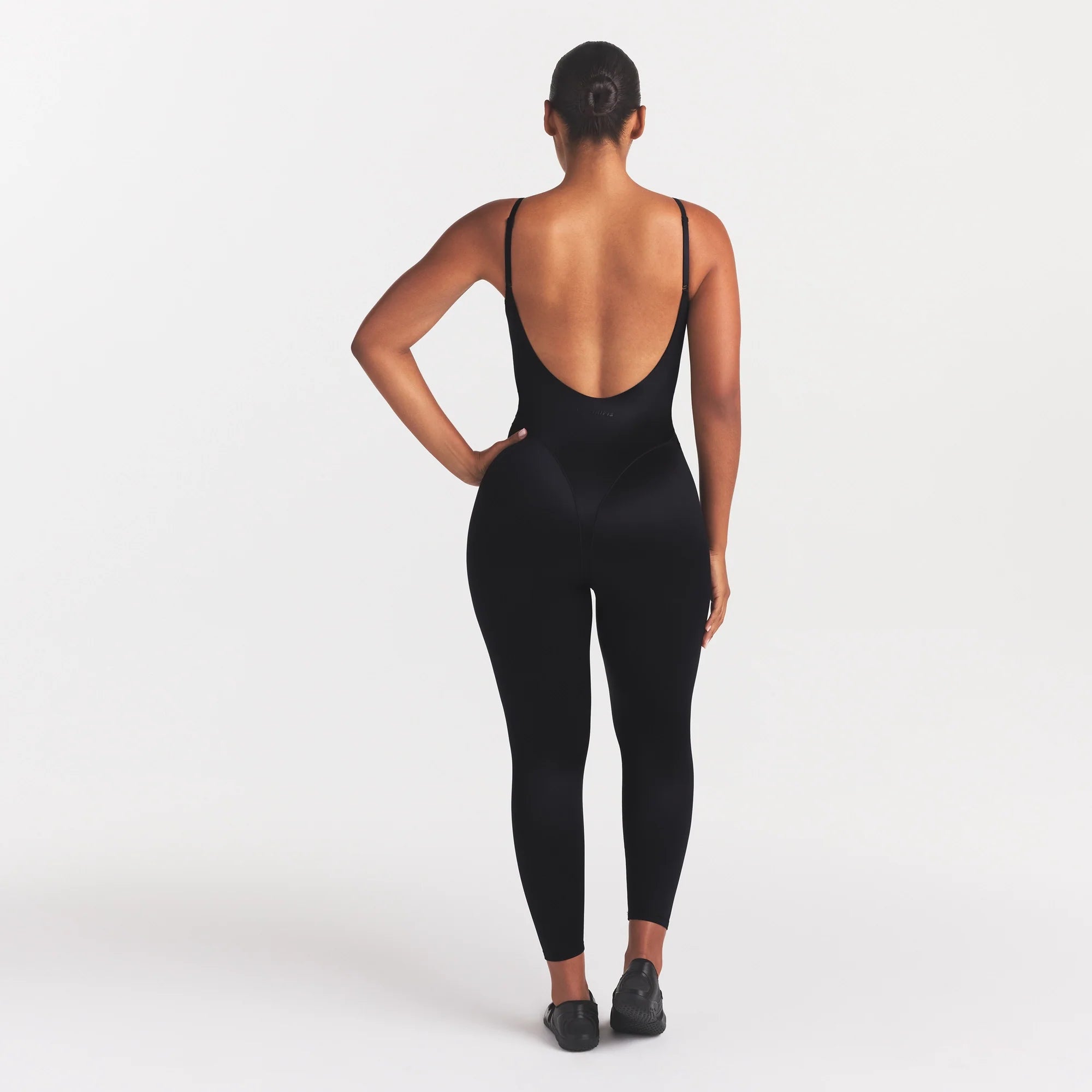 NikeSKIMS SATIN SHINE CAMI 26" ONE PIECE | OBSIDIAN ON A MODEL FRONT VIEW