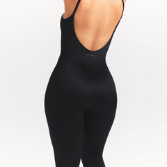 NikeSKIMS SATIN SHINE CAMI 26" ONE PIECE | OBSIDIAN ON A MODEL SIDE VIEW