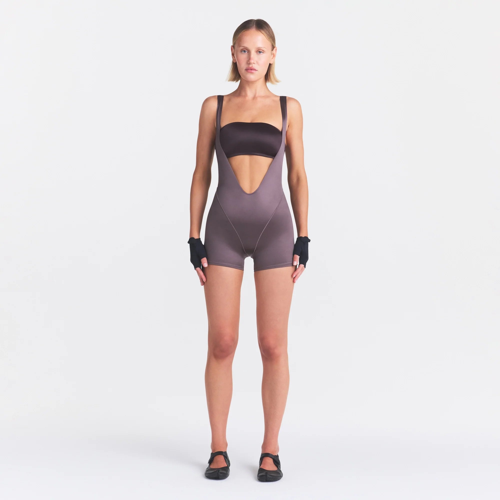 NikeSKIMS SATIN SHINE SUSPENDER 2.5" ONESIE | RESIN ON A MODEL FRONT VIEW