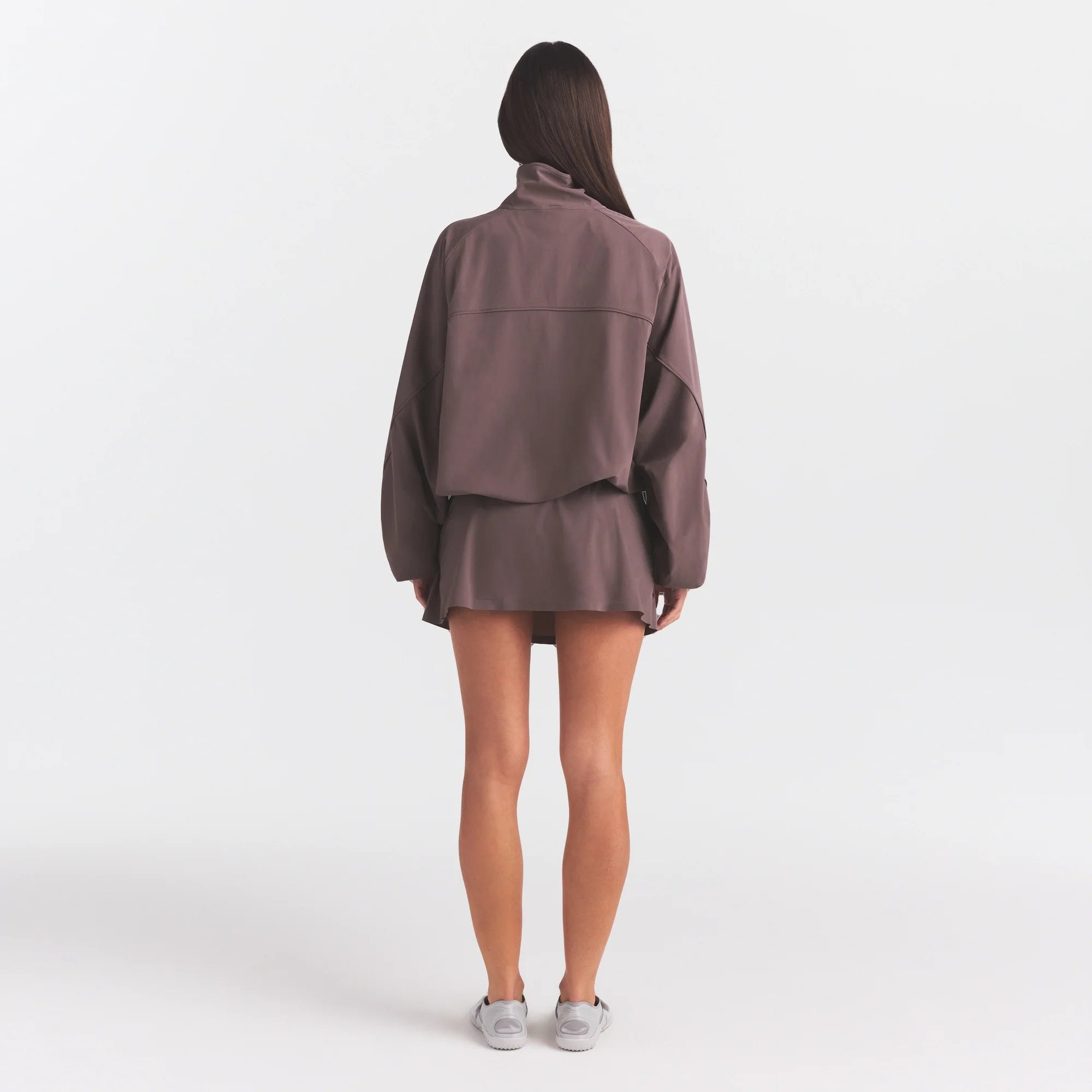 NikeSKIMS STRETCH NYLON OVERSIZED JACKET | RESIN ON A MODEL FRONT VIEW @ | FOCUS: 0.0, 1.0, 0.9