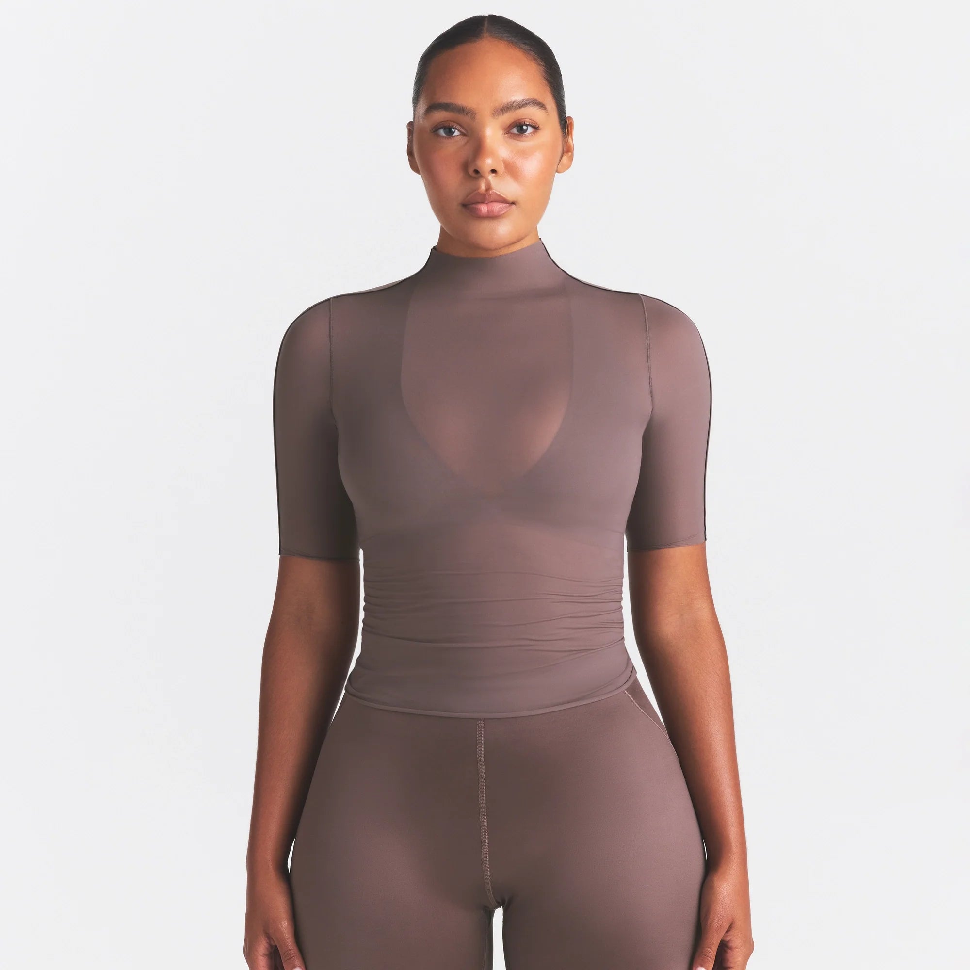 NikeSKIMS WEIGHTLESS LAYERS MOCK NECK SHORT SLEEVE T-SHIRT | RESIN ON A MODEL SIDE VIEW @ | FOCUS: 0.0, 1.0, 0.9