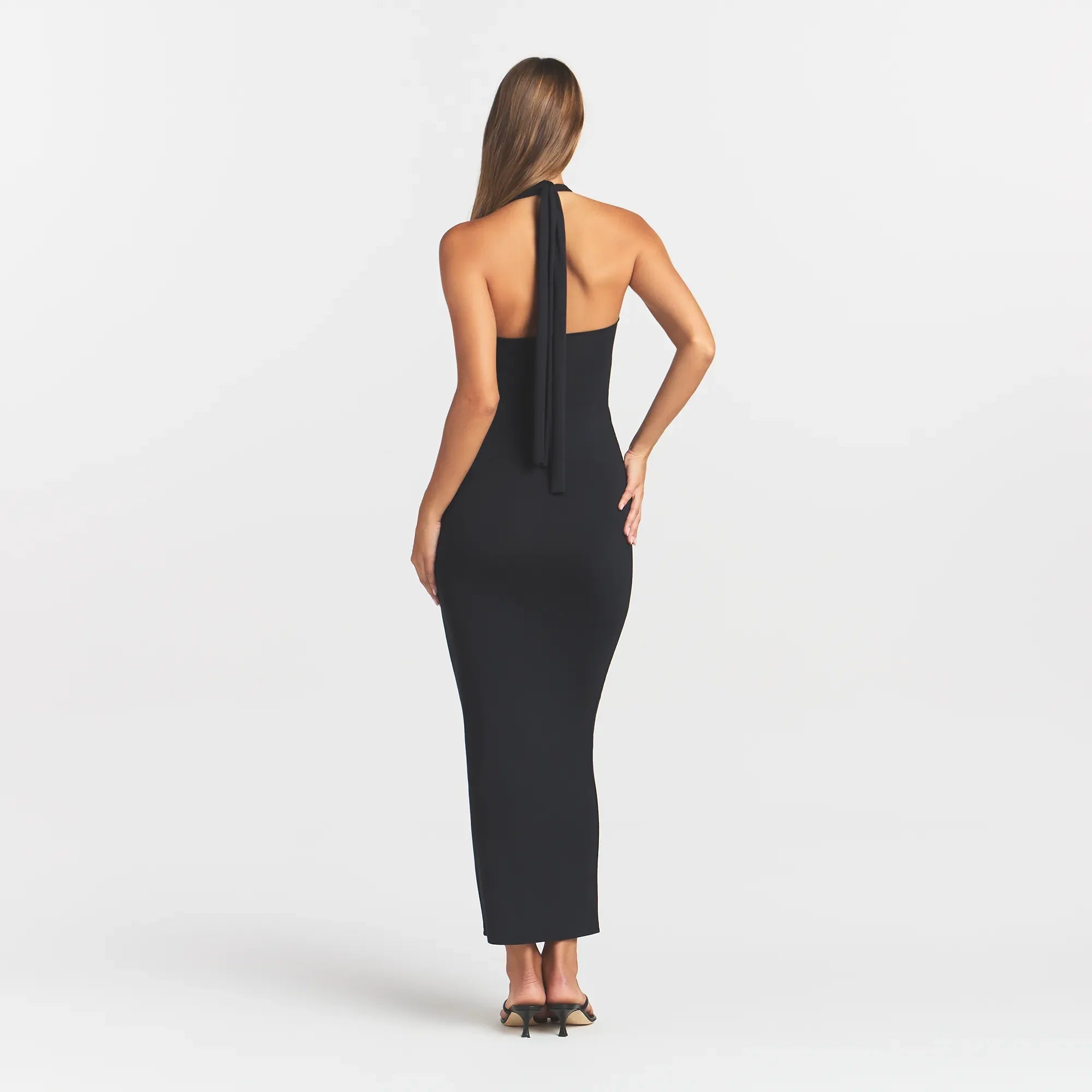 SMOOTH LAYERS CONVERTIBLE LONG DRESS | OBSIDIAN ON A MODEL BACK VIEW @ | FOCUS: 0.0, 1.0, 0.9