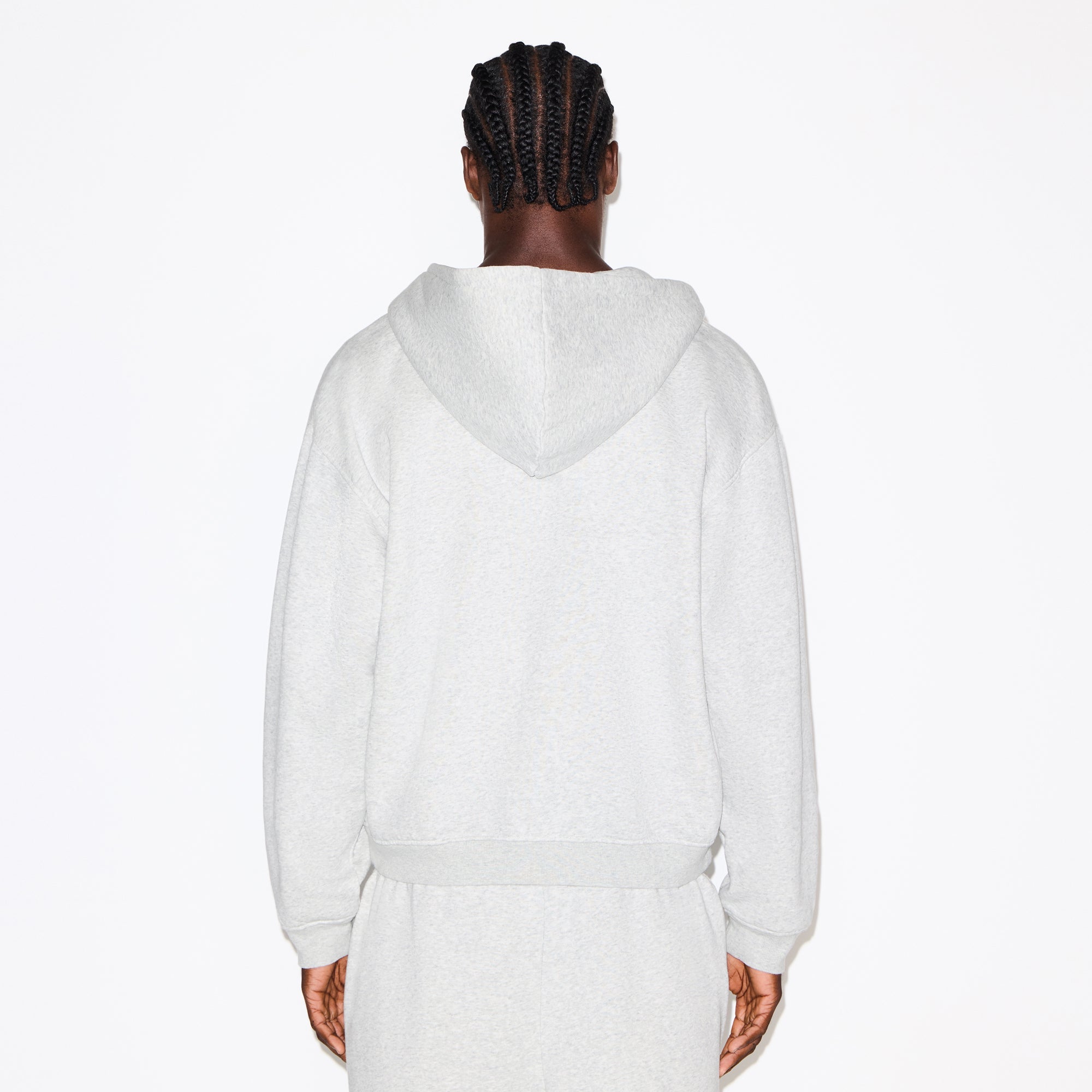 FLEECE LOUNGE MENS RELAXED ZIP UP HOODIE | LIGHT HEATHER GREY ON A MODEL SIDE VIEW @ | FOCUS: 0.0, 1.0, 0.9