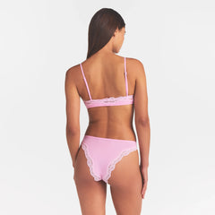 FITS EVERYBODY LACE TANGA | BUBBLE GUM TONAL ON A MODEL SIDE VIEW @ | FOCUS: 0.0, 1.0, 0.9