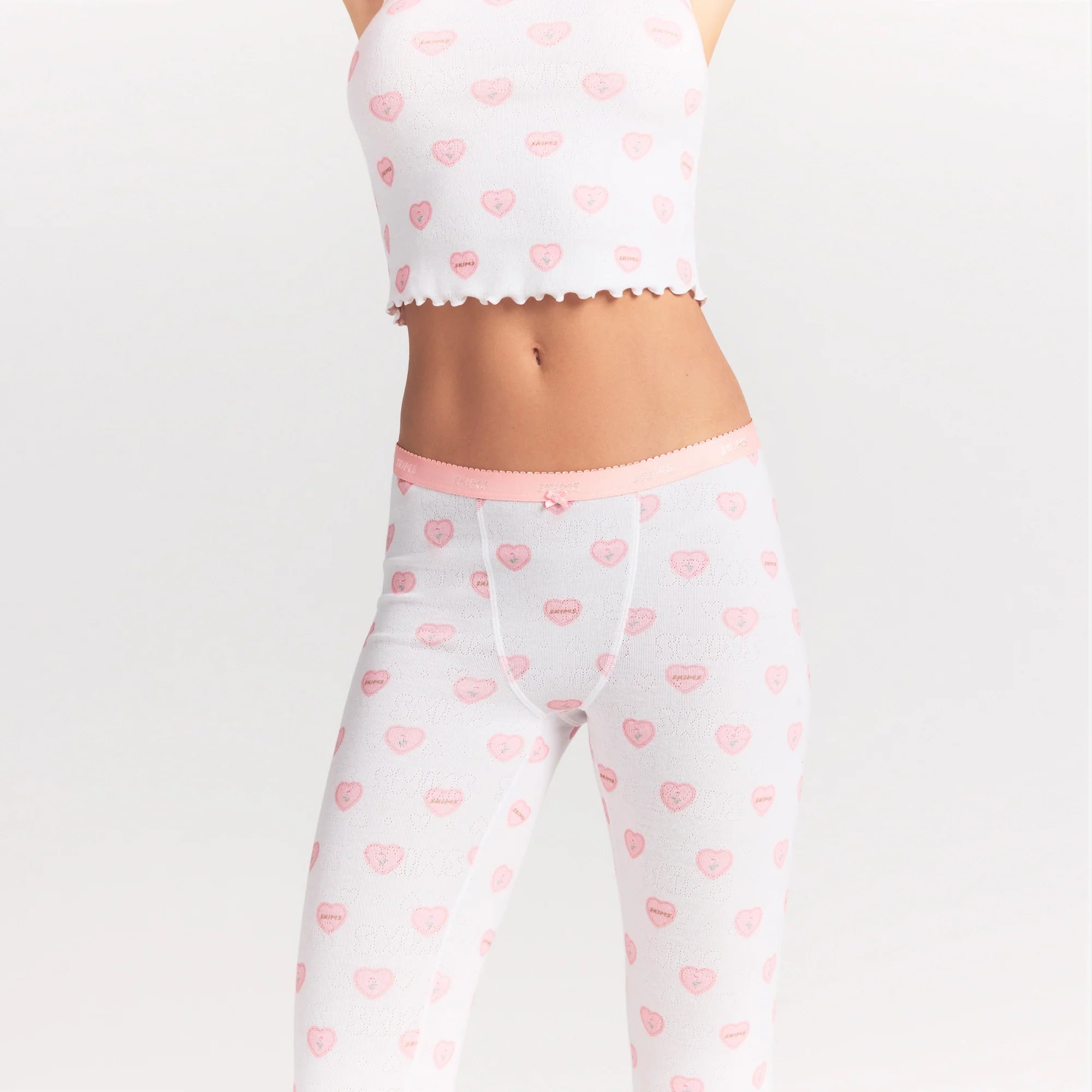 LOGO POINTELLE CAPRI | SNOW LACE HEARTS ON A MODEL SIDE VIEW @ | FOCUS: 0.0, 1.0, 0.9