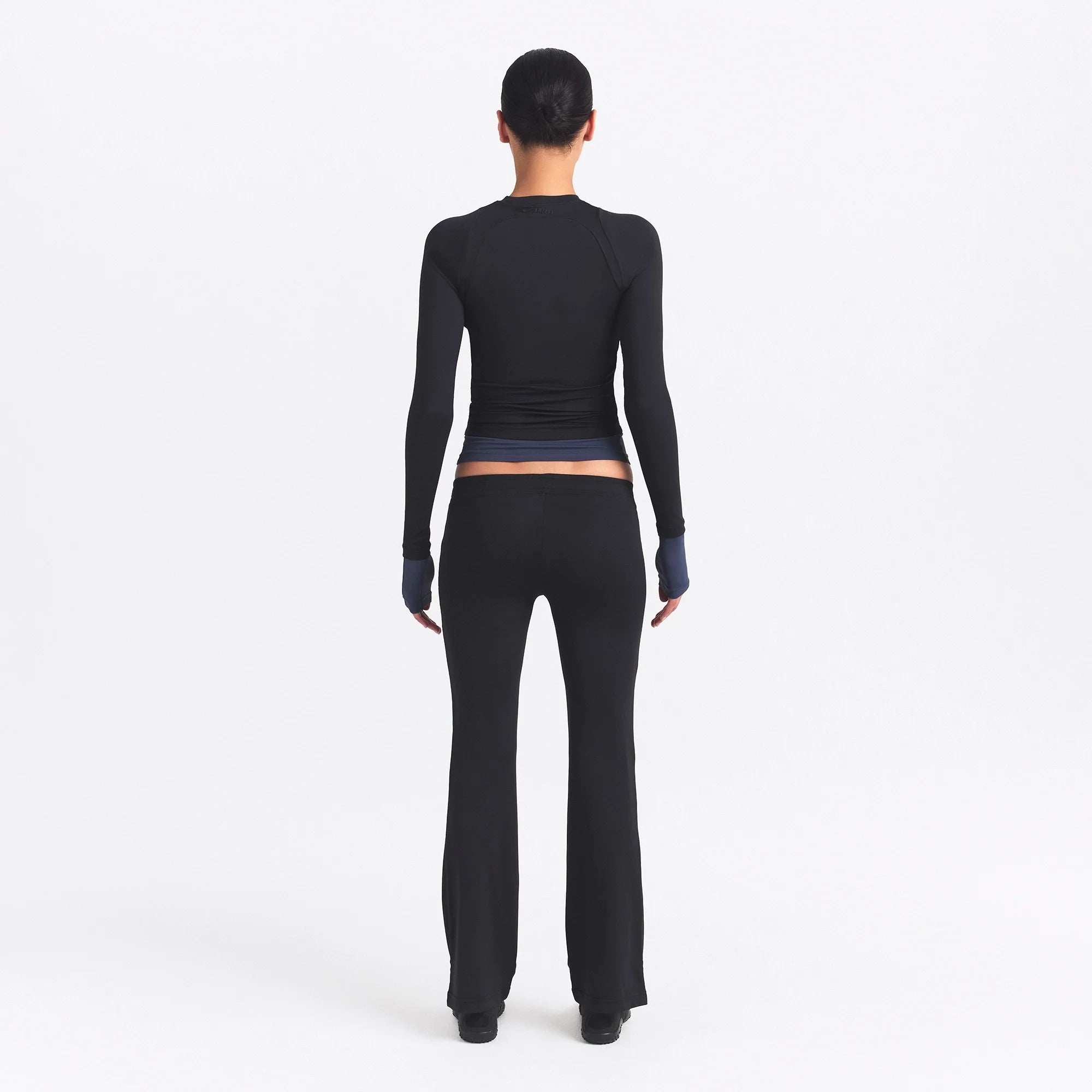 NikeSKIMS AIRY STRAIGHT LEG PANT | OBSIDIAN ON A MODEL SIDE VIEW @ | FOCUS: 0.0, 1.0, 0.9