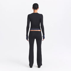 NikeSKIMS AIRY STRAIGHT LEG PANT | OBSIDIAN ON A MODEL SIDE VIEW @ | FOCUS: 0.0, 1.0, 0.9