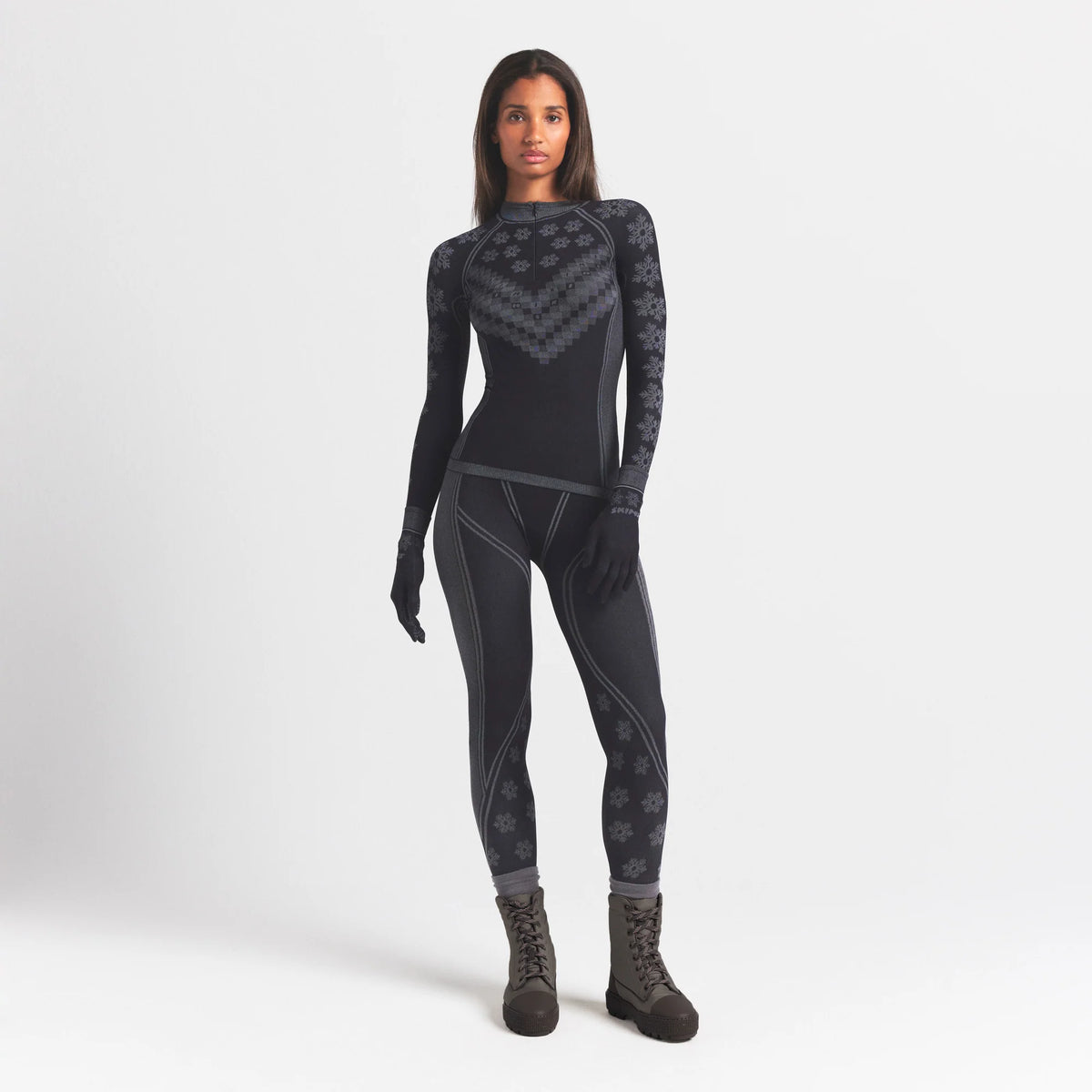 SKIMS FIRST LAYERS LEGGING | OBSIDIAN WINTER FAIR ISLE ON A MODEL FRONT VIEW @ | FOCUS: 0.0, 1.0, 0.9