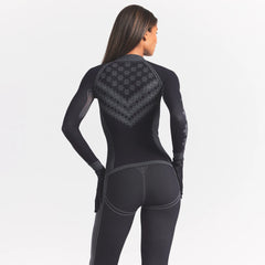 SKIMS FIRST LAYERS LEGGING | OBSIDIAN WINTER FAIR ISLE ON A MODEL SIDE VIEW @ | FOCUS: 0.0, 1.0, 0.9