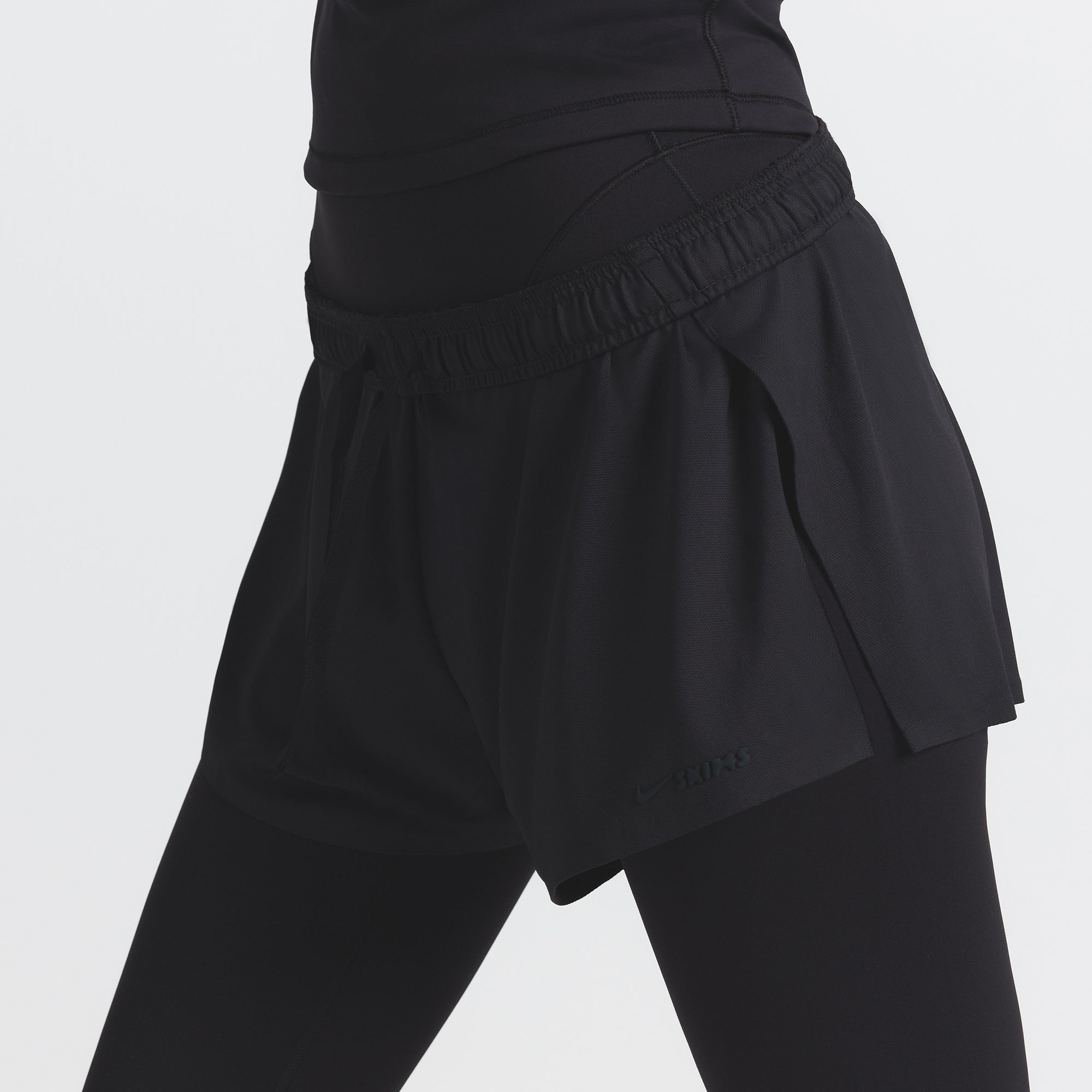 NikeSKIMS AIRY MINI SHORT | OBSIDIAN ON A MODEL FRONT VIEW @ | FOCUS: 0.9, 0.1, 0.7