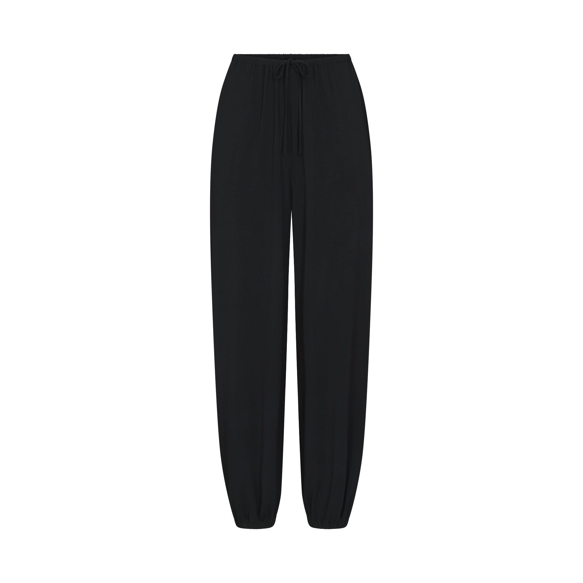 SKIMS SLEEP JOGGER | ONYX FLAT ON A WHITE BACKGROUND | FLT