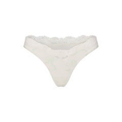 FITS EVERYBODY LACE DIPPED THONG 5-PACK | IVORY PEARL BOW MULTI LAYS FLAT ON A WHITE BACKGROUND