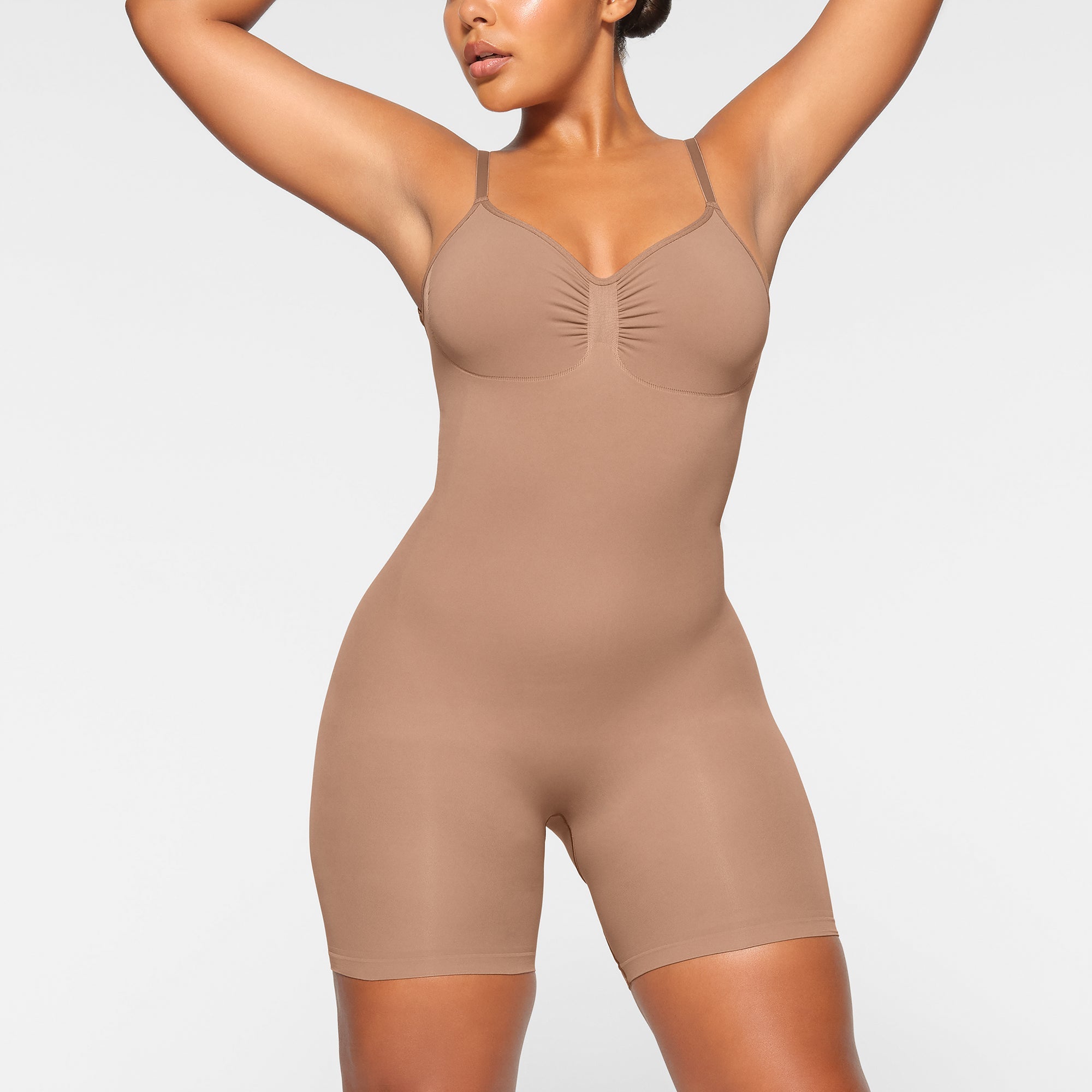 SEAMLESS SCULPT LOW BACK MID THIGH BODYSUIT WORN BY A MODEL IN FRONT VIEW, XL