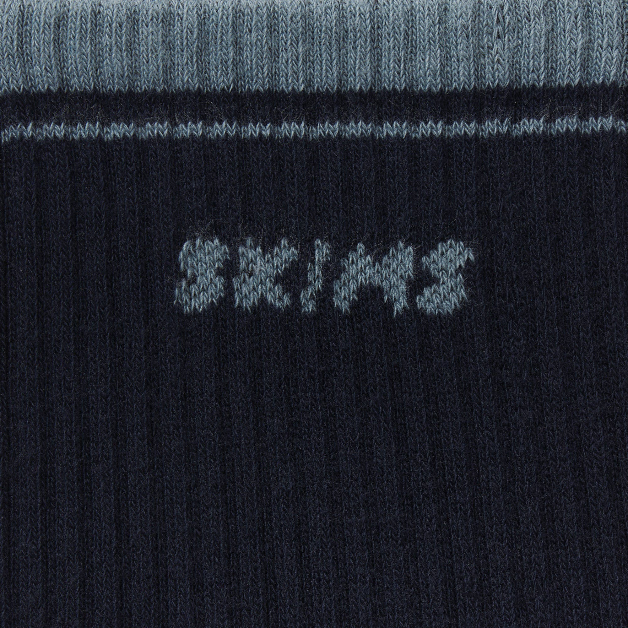 RIBBED QUARTER CREW LOGO SOCK | NAVY AND KYANITE & LAYS FLAT ON A WHITE BACKGROUND | FLT