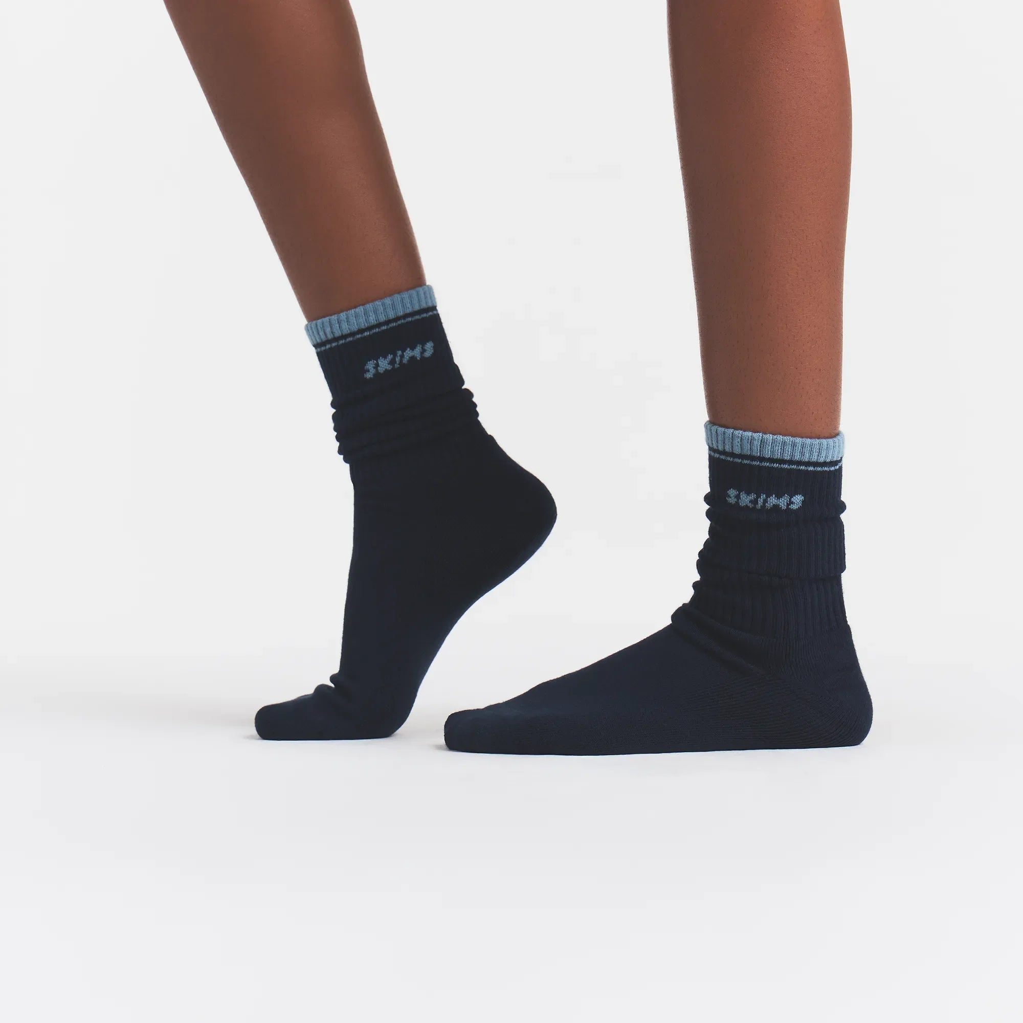 RIBBED CREW LOGO SOCK | NAVY AND KYANITE ON A MODEL | FOCUS: 0.0, 1.0, 0.9