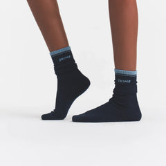 RIBBED CREW LOGO SOCK | NAVY AND KYANITE ON A MODEL | FOCUS: 0.0, 1.0, 0.9