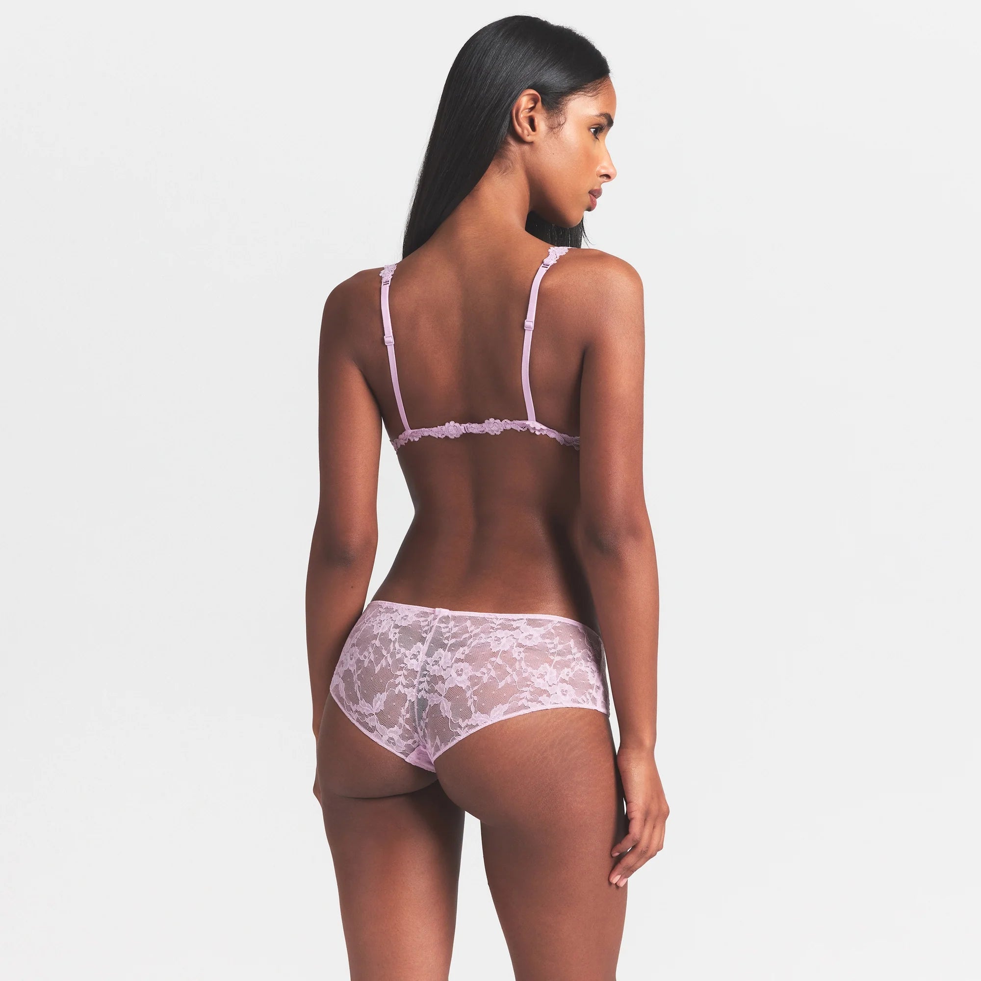 STRETCH LACE TRIANGLE BRALETTE | BABY PINK ON A MODEL SIDE VIEW @ | FOCUS: 0.0, 1.0, 0.9