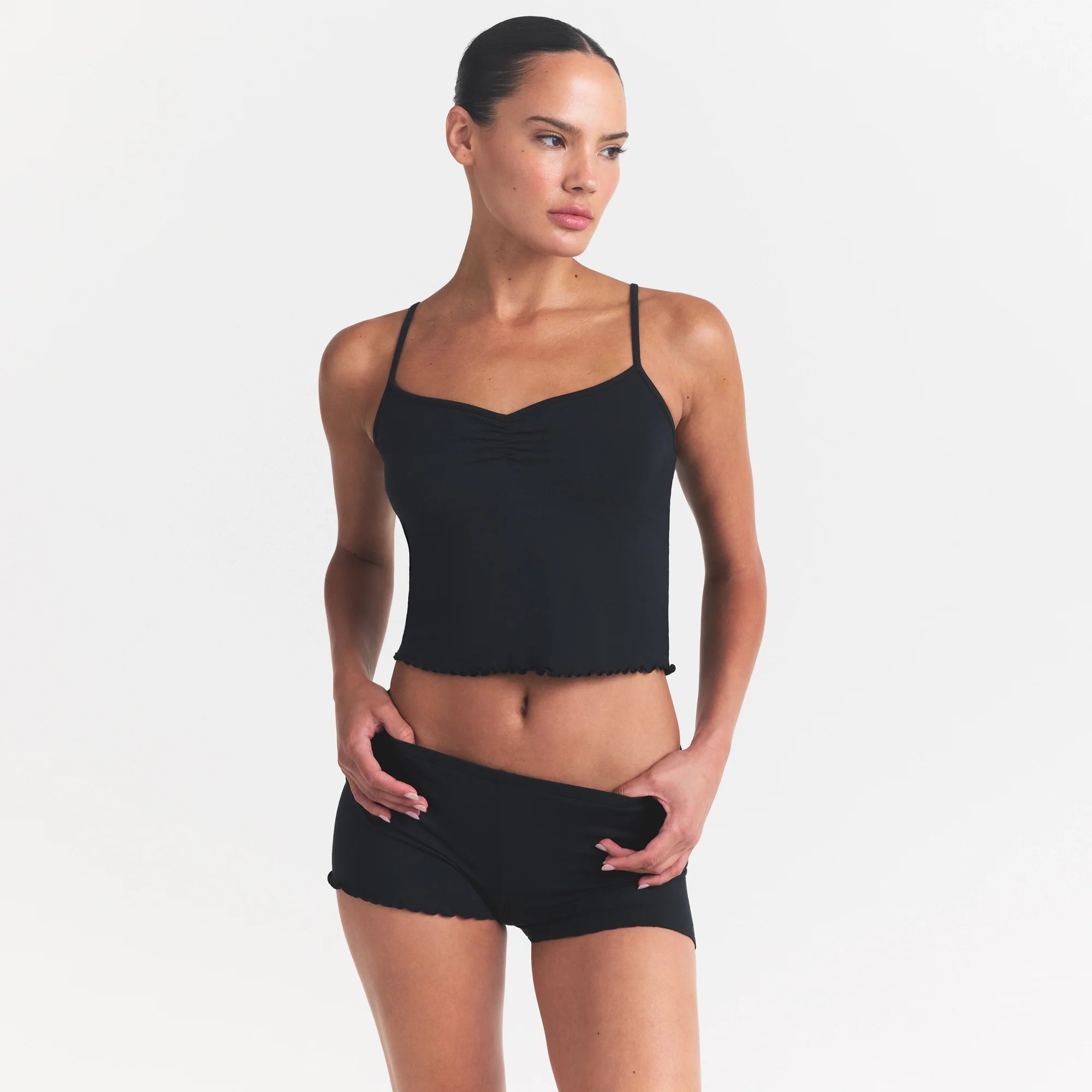 SKIMS SLEEP CAMI SET | ONYX ON A MODEL SIDE VIEW @ | FOCUS: 0.0, 1.0, 0.9