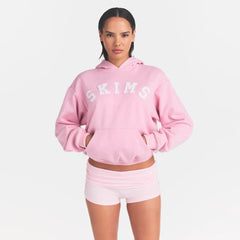 COTTON FLEECE CLASSIC HOODIE | HALITE WITH SNOW LOGO ON A MODEL FRONT VIEW @ | FOCUS: 0.0, 1.0, 0.9