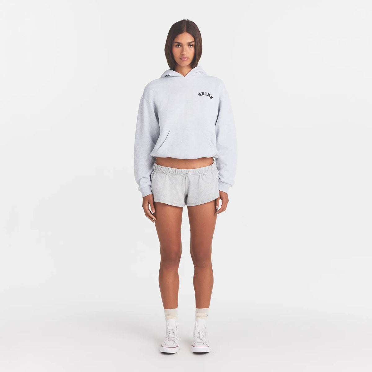 COTTON FLEECE CLASSIC HOODIE | LIGHT HEATHER GREY WITH ONYX LOGO ON A MODEL FRONT VIEW @ | FOCUS: 0.0, 1.0, 0.9
