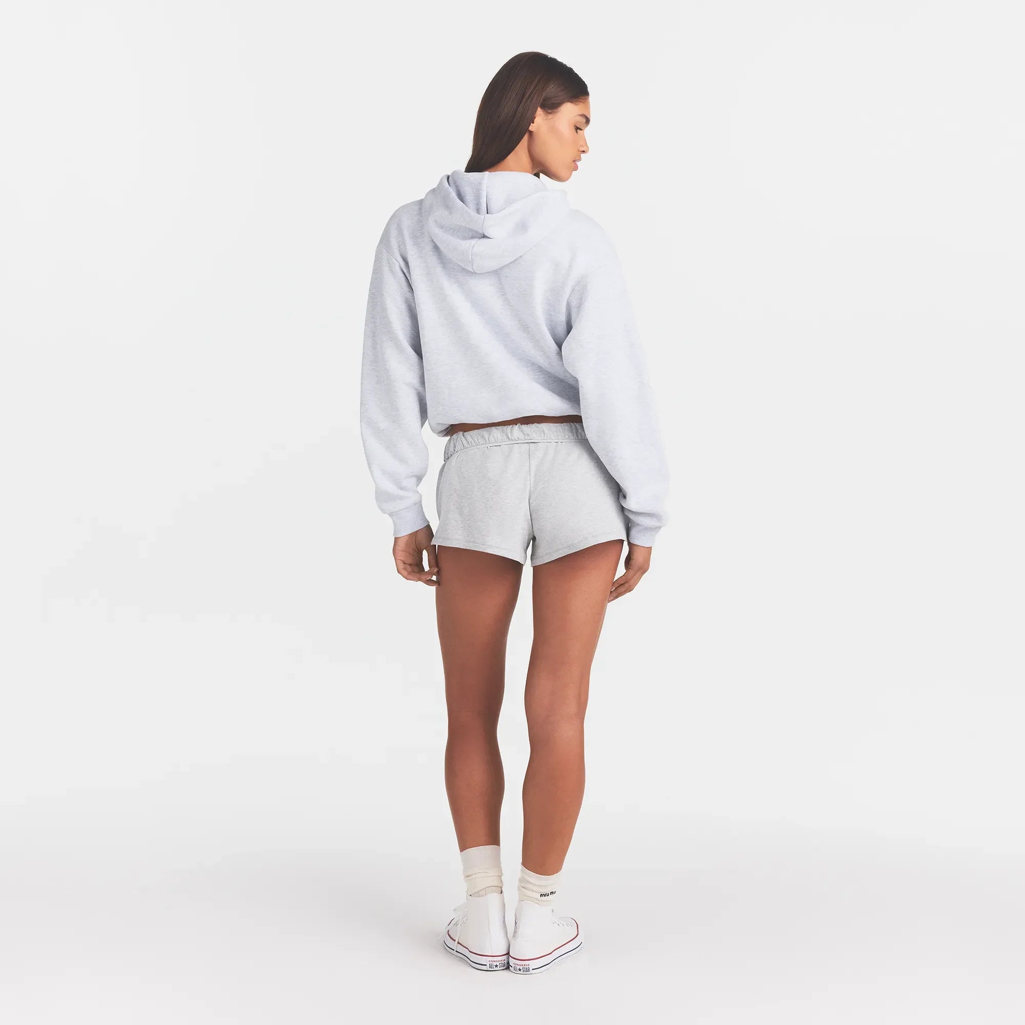 COTTON FLEECE CLASSIC HOODIE | LIGHT HEATHER GREY WITH ONYX LOGO ON A MODEL BACK VIEW @ | FOCUS: 0.0, 1.0, 0.9