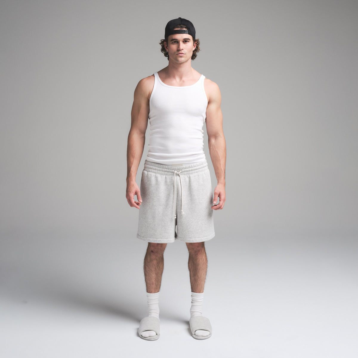 SKIMS COTTON MENS RIB TANK 3-PACK | CHALK ON A MODEL FRONT VIEW | FOCUS: 0.0, 1.0, 0.9