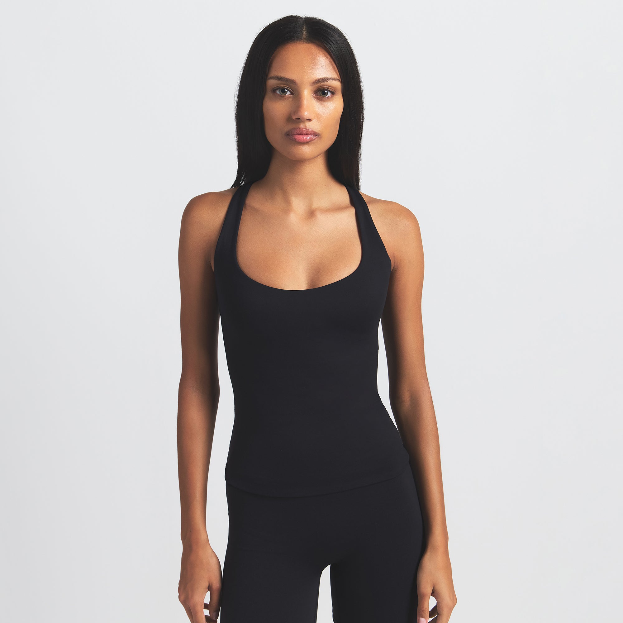 NikeSKIMS MATTE RACER BACK TANK | OBSIDIAN ON A MODEL FRONT VIEW