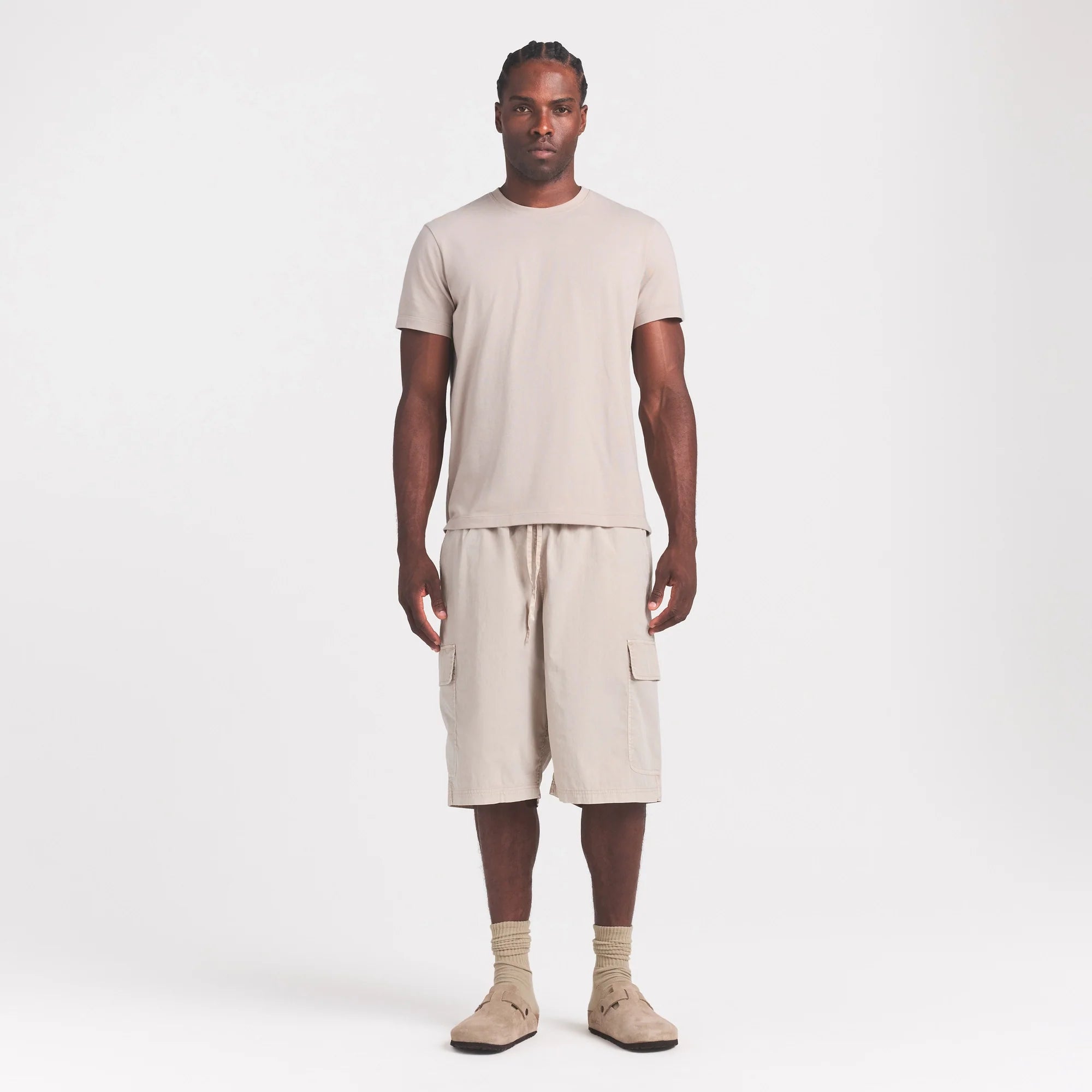 SKIMS COTTON MENS CLASSIC T-SHIRT | STONE ON A MODEL FRONT VIEW @ | FOCUS: 0.0, 1.0, 0.9