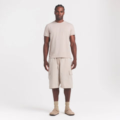 SKIMS COTTON MENS CLASSIC T-SHIRT | STONE ON A MODEL FRONT VIEW @ | FOCUS: 0.0, 1.0, 0.9